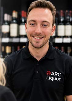ARC Liquor team member helping a customer